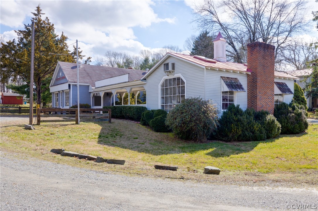 1037 Broad St Road Manakin-Sabot, VA 23103 - Photo 48 of 50 a view of a house with a yard covered with snow and plants