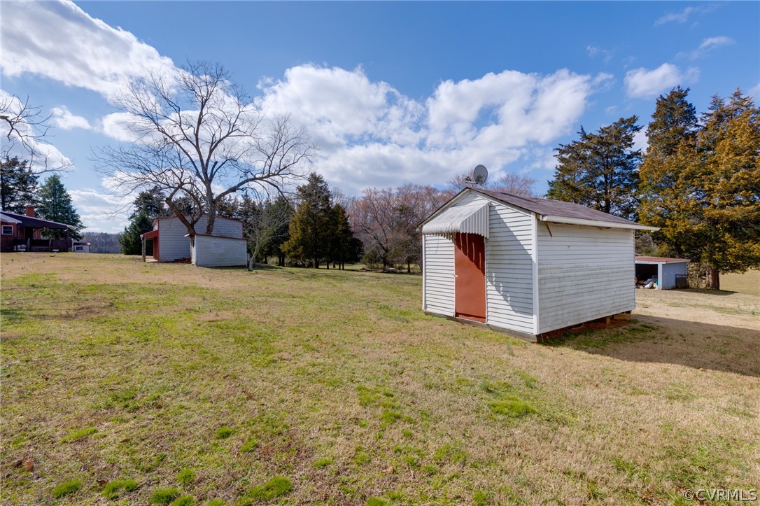 1037 Broad St Road Manakin-Sabot, VA 23103 - Photo 8 of 50 a view of a house with a yard and garage