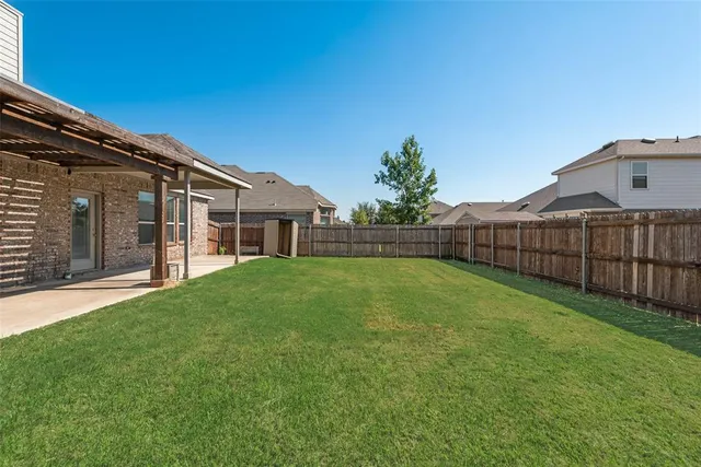 a view of backyard with green space