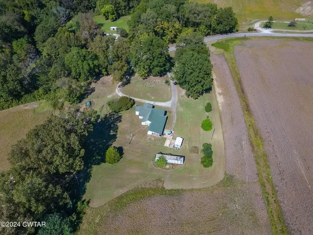 an aerial view of residential house with outdoor space