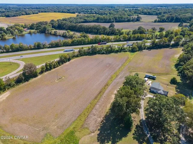 an aerial view of a city with lake view