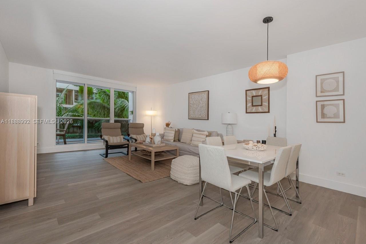 a living room with furniture a window and a table