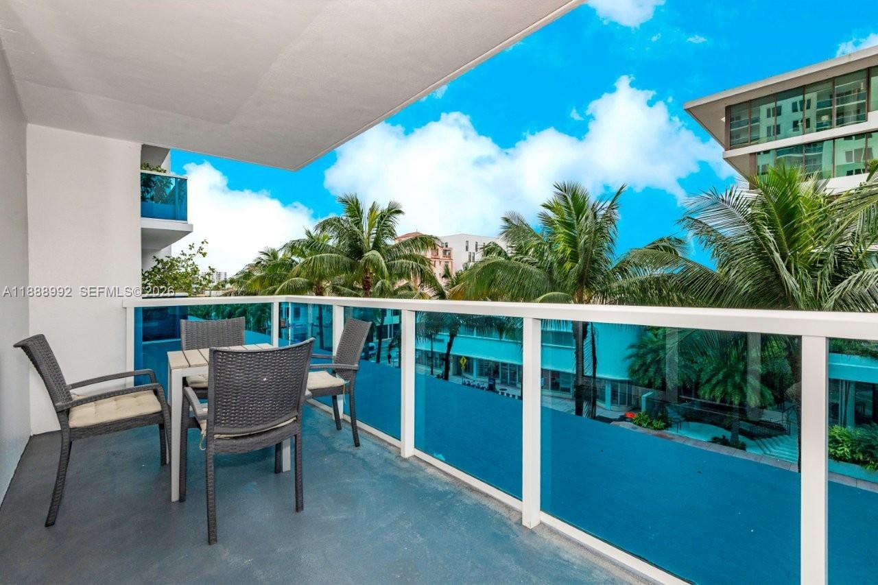 2301 Collins Avenue, Unit 333 Miami Beach, FL 33139 - Photo 26 of 37 a view of a chairs and table in patio