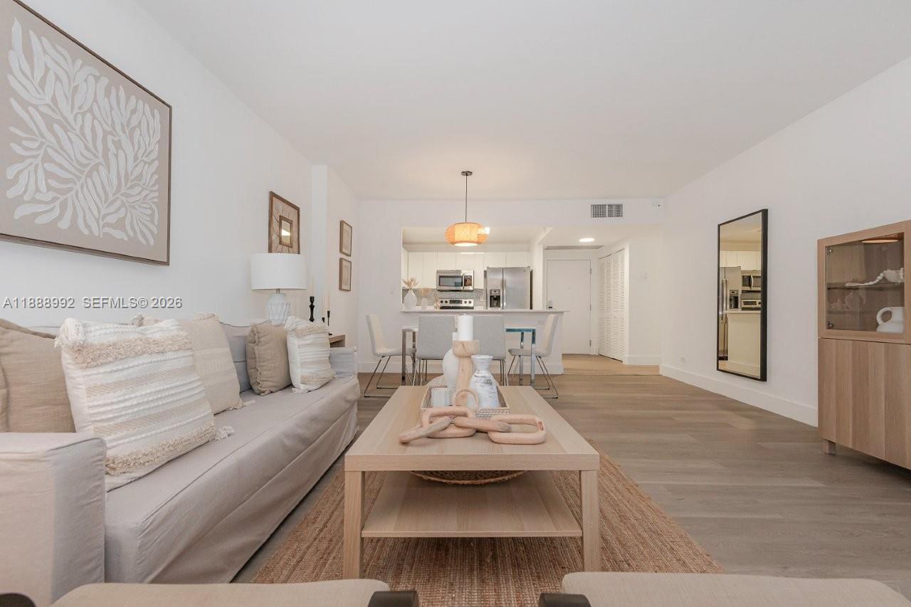 2301 Collins Avenue, Unit 333 Miami Beach, FL 33139 - Photo 5 of 37 a view of a livingroom with furniture and a table