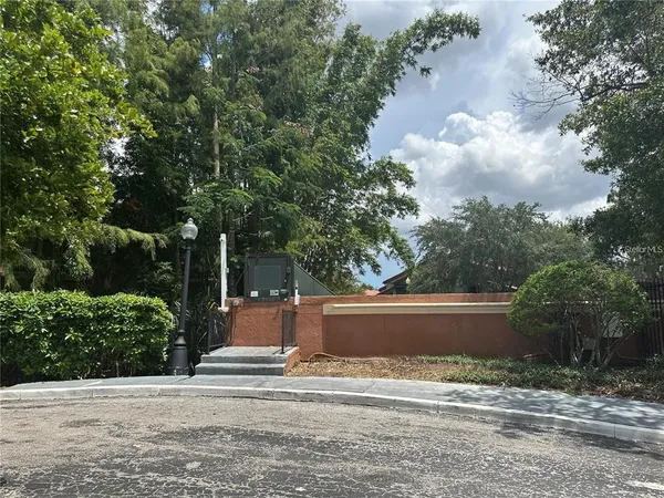 a view of a playground with basketball court