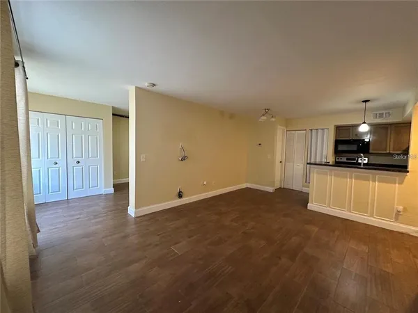 a view of a kitchen with a sink and a stove top oven
