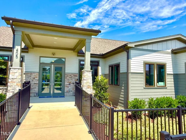 a view of a house with large windows
