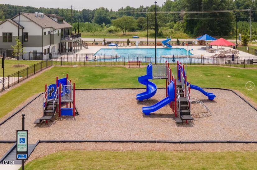 520 Eversden Drive Zebulon, NC 27597 - Photo 24 of 24 a view of swimming pool with a bench and lounge chairs
