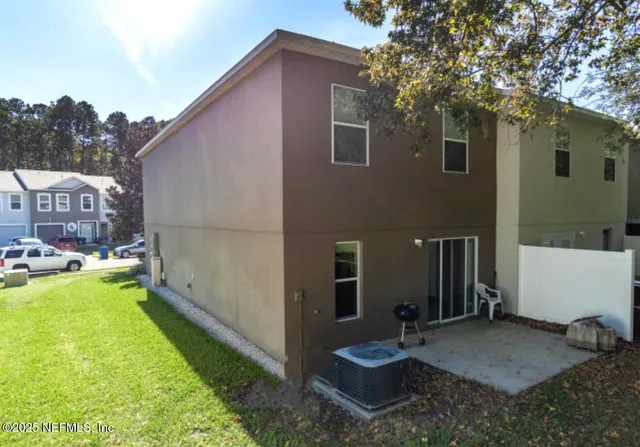 a backyard of a house with garden and patio