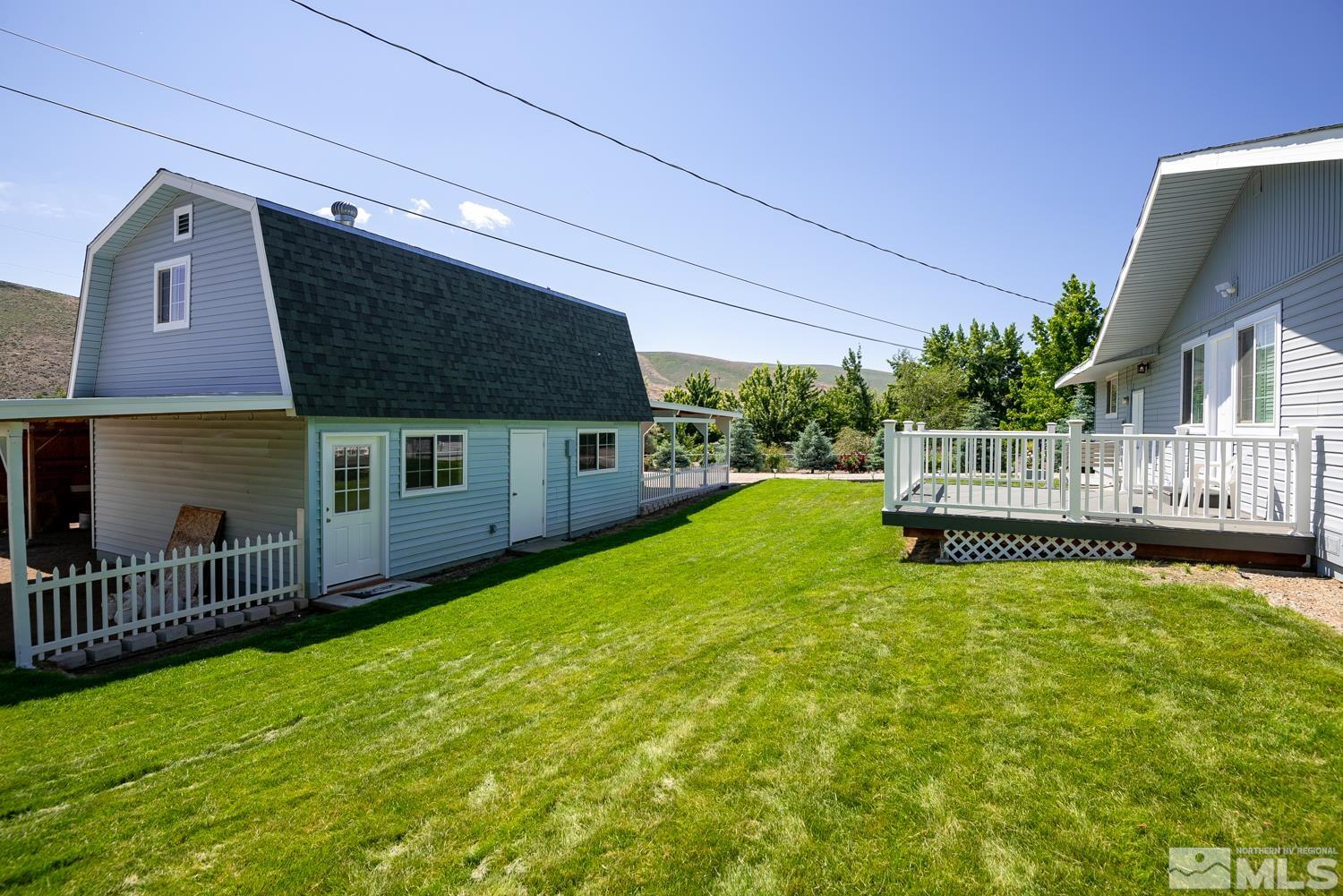 270 Kitts Way Reno, NV 89521 - Photo 11 of 16 a view of a house with a yard and deck