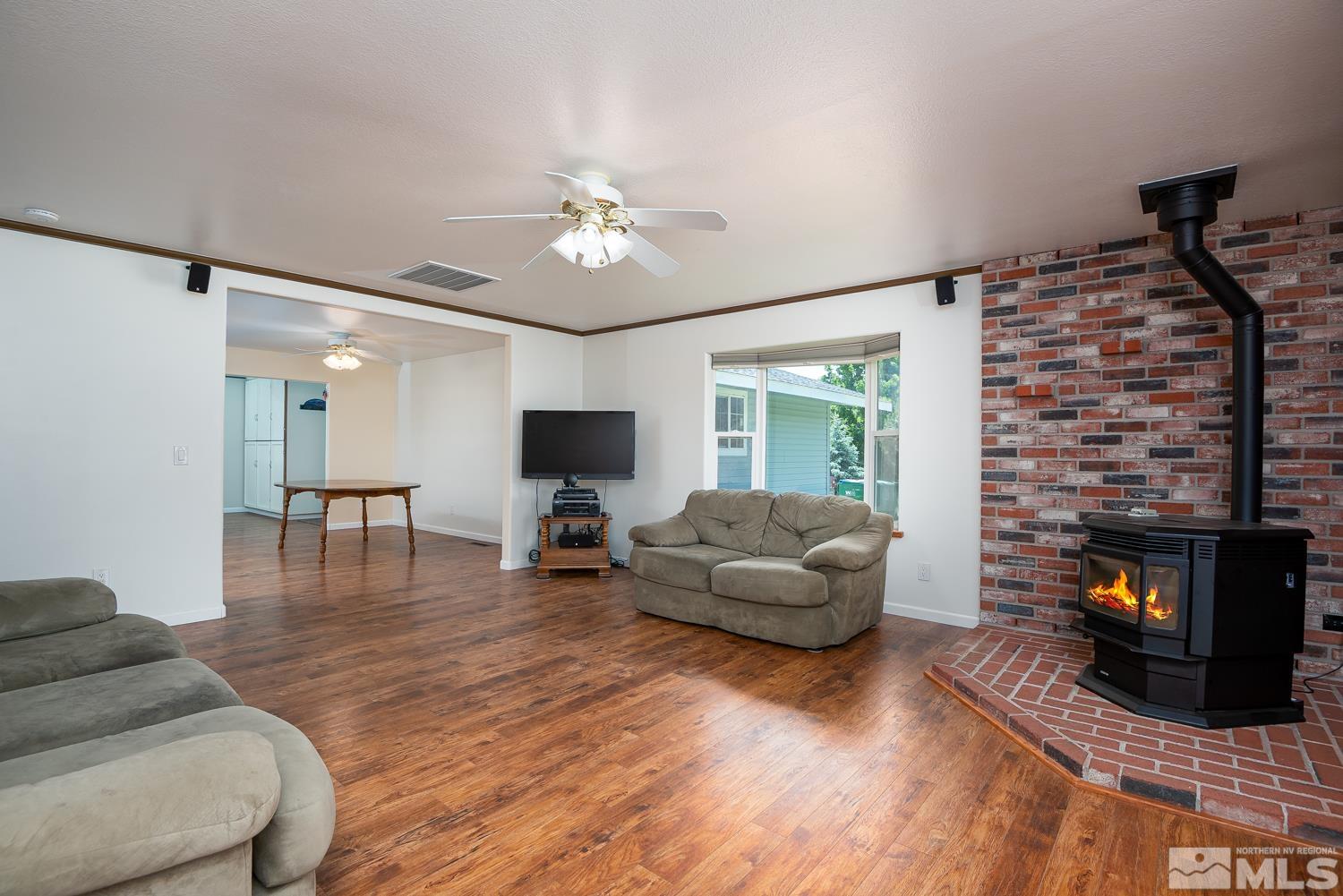 270 Kitts Way Reno, NV 89521 - Photo 8 of 16 a living room with furniture and a flat screen tv
