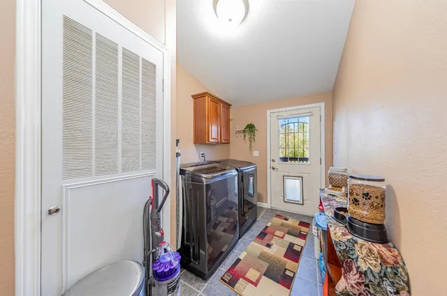 a bathroom with a sink vanity mirror and toilet