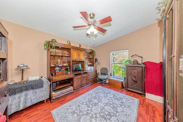 a bedroom with furniture and a window