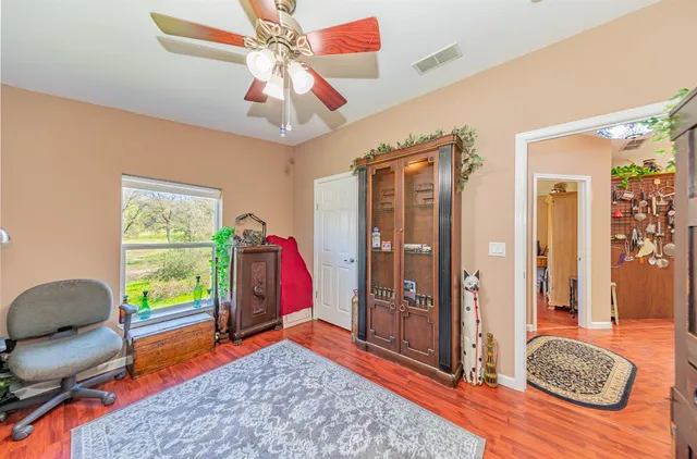 a bedroom with a bed and a table