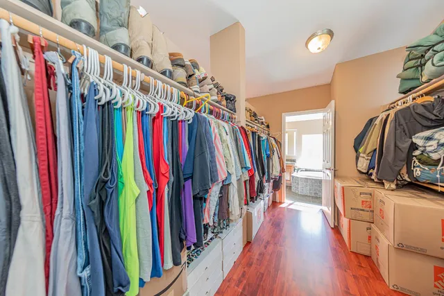 a bathroom with a granite countertop sink mirror and a bathtub