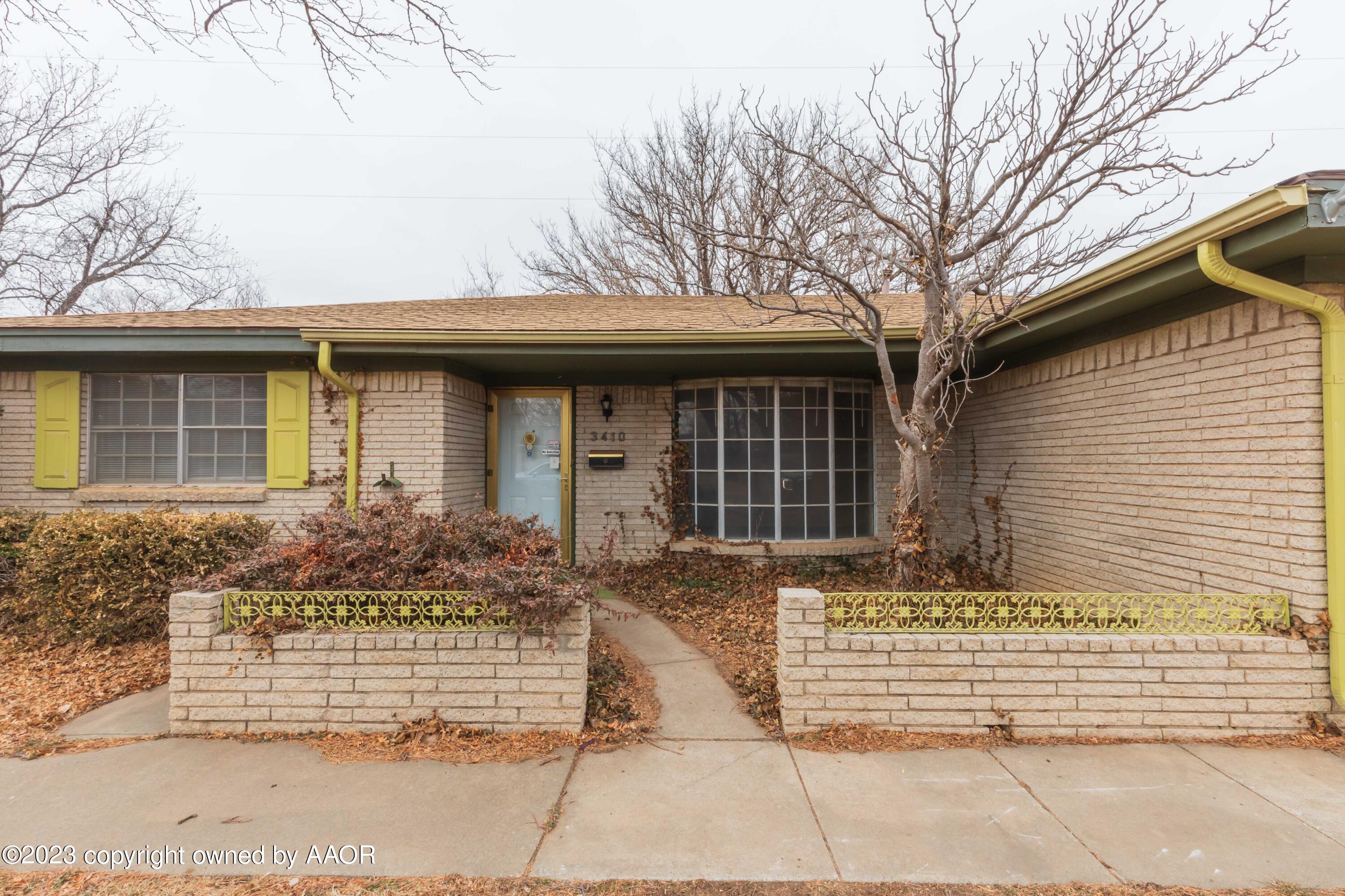a front view of a house with garage