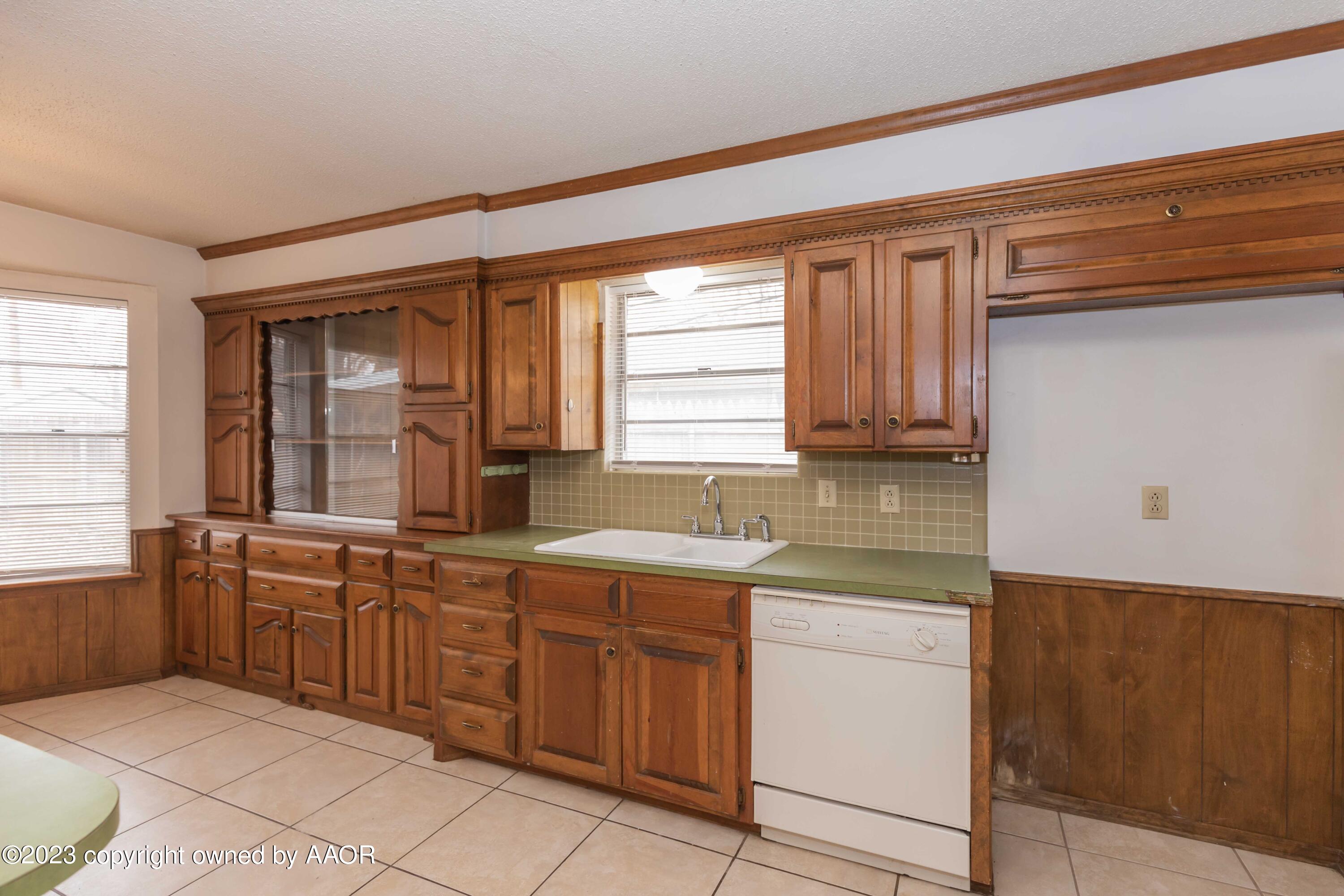 3410 Harmony Street Amarillo, TX 79109 - Photo 12 of 41 a kitchen with a sink and cabinets