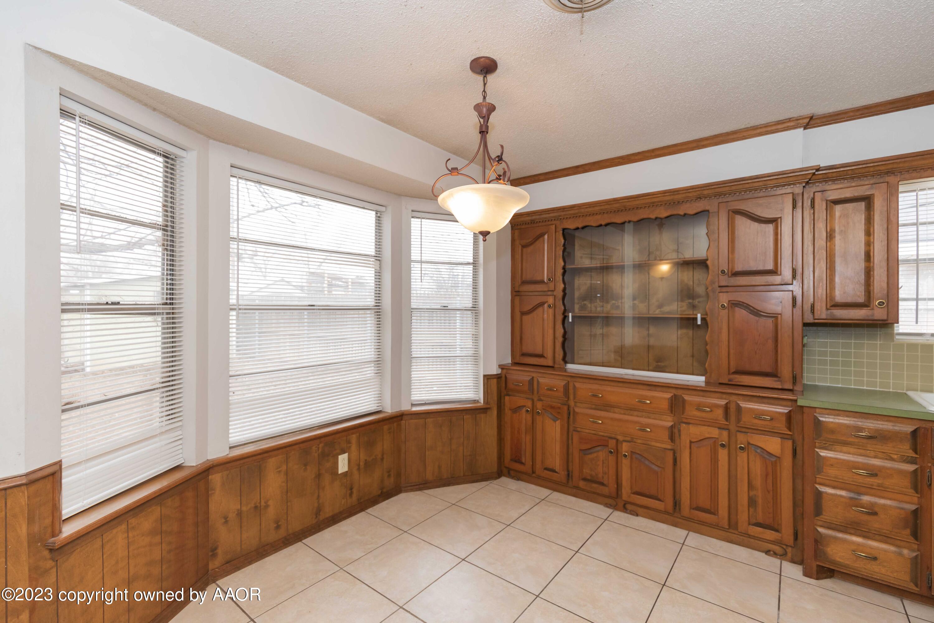 3410 Harmony Street Amarillo, TX 79109 - Photo 13 of 41 a bathroom with a tub sink and mirror