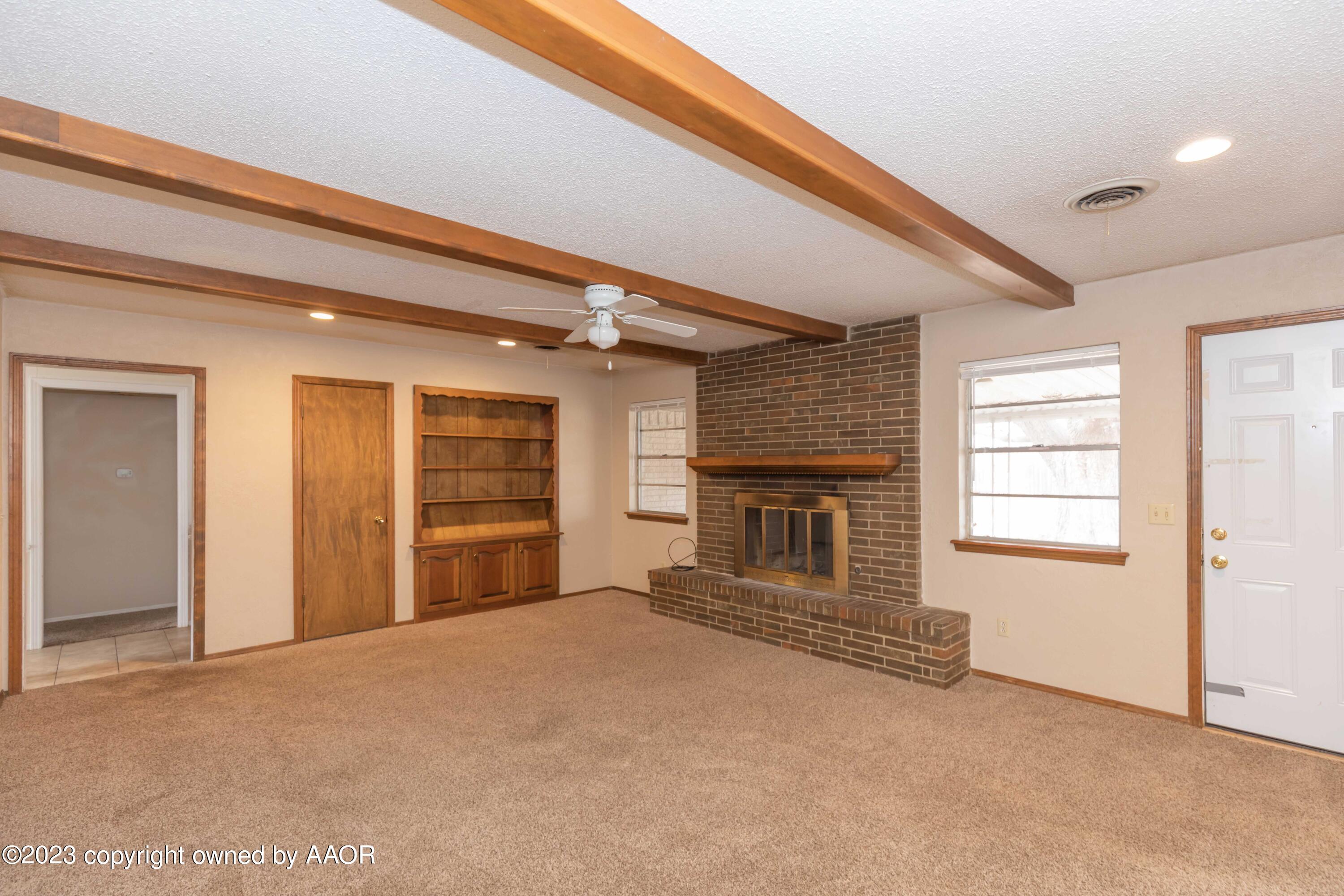 3410 Harmony Street Amarillo, TX 79109 - Photo 17 of 41 a view of a livingroom with a fireplace