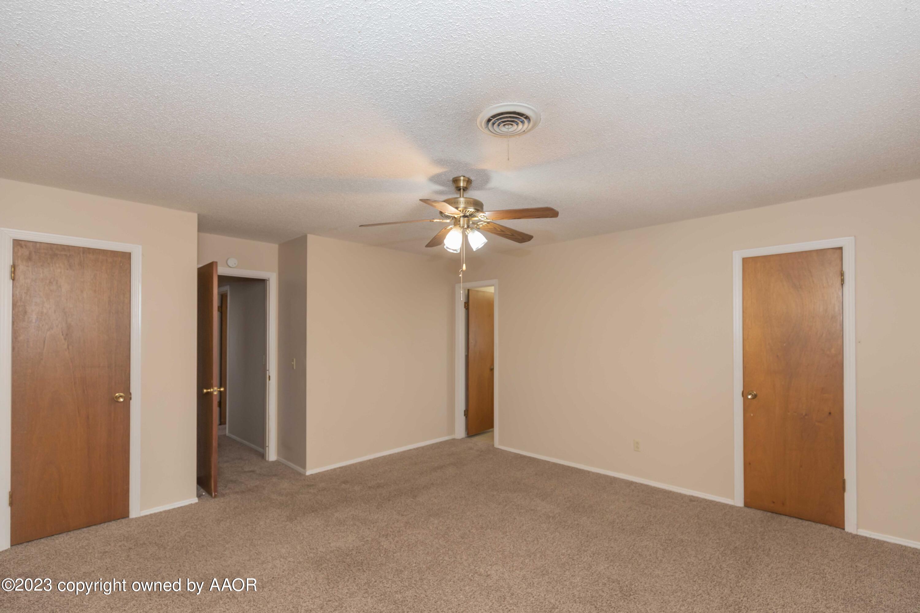 3410 Harmony Street Amarillo, TX 79109 - Photo 20 of 41 a view of a chandelier fan and closet in a room