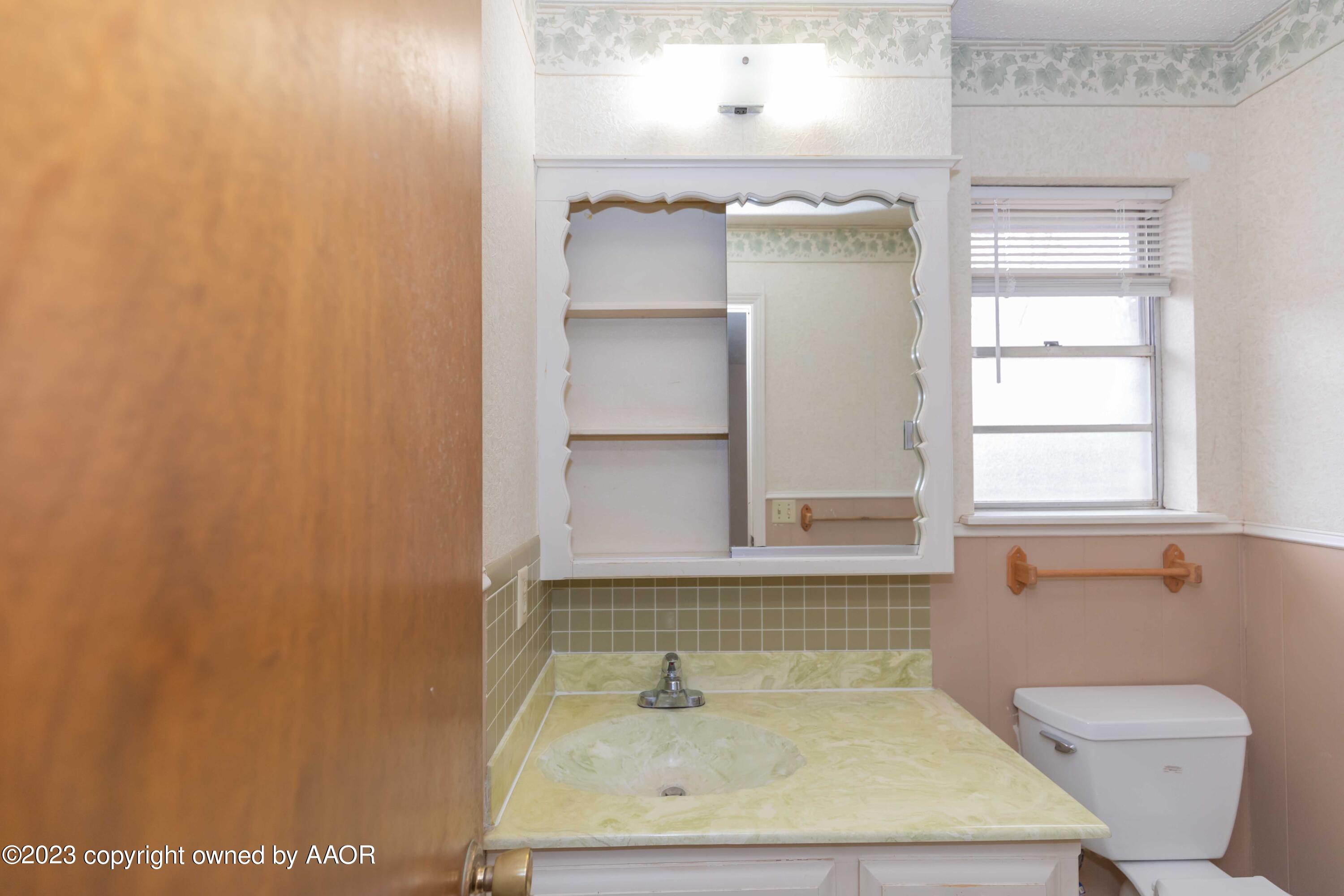 3410 Harmony Street Amarillo, TX 79109 - Photo 25 of 41 a bathroom with a sink and a toilet