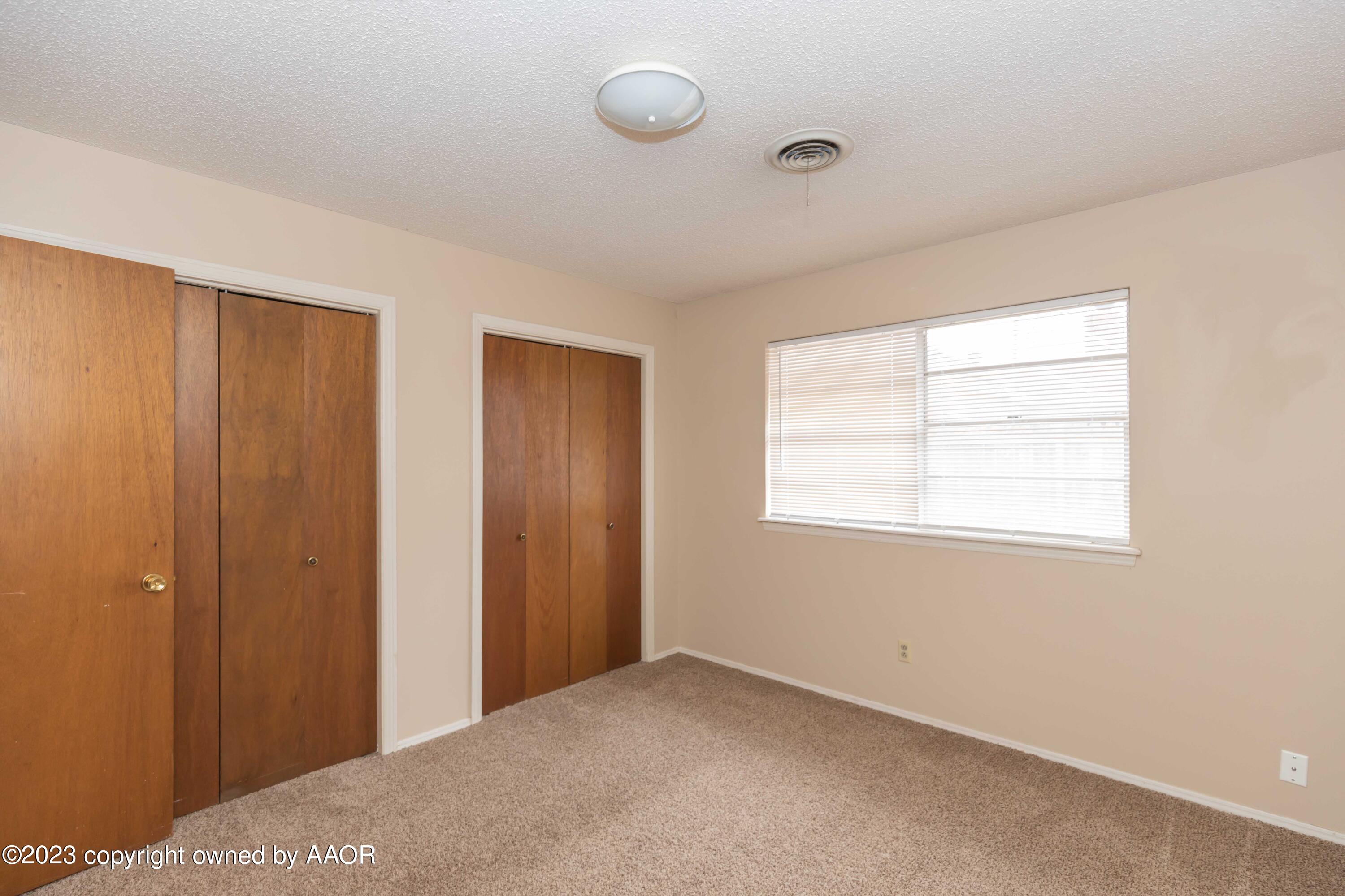 3410 Harmony Street Amarillo, TX 79109 - Photo 27 of 41 a view of an empty room with window and closet area