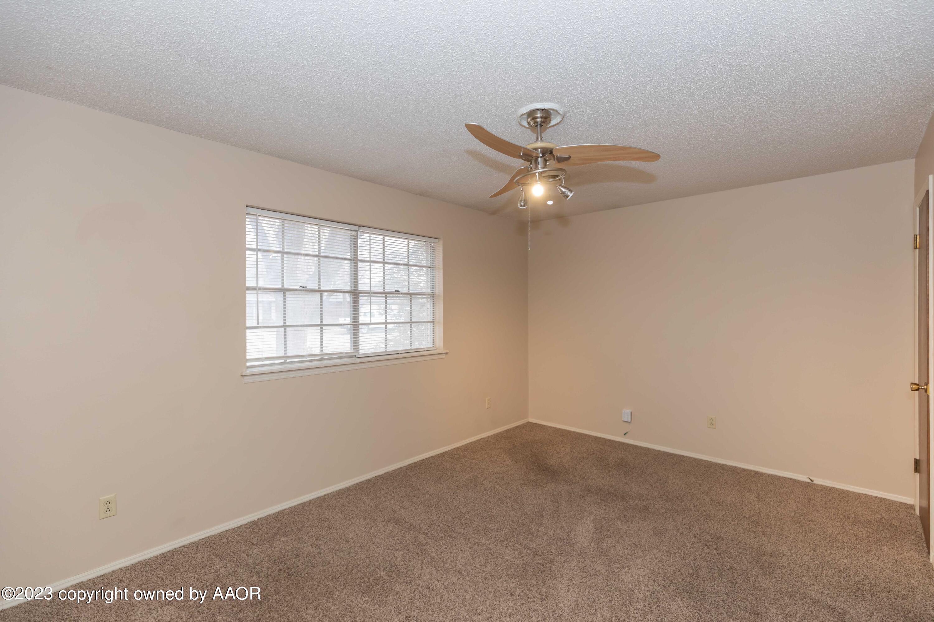 3410 Harmony Street Amarillo, TX 79109 - Photo 33 of 41 an empty room with a window