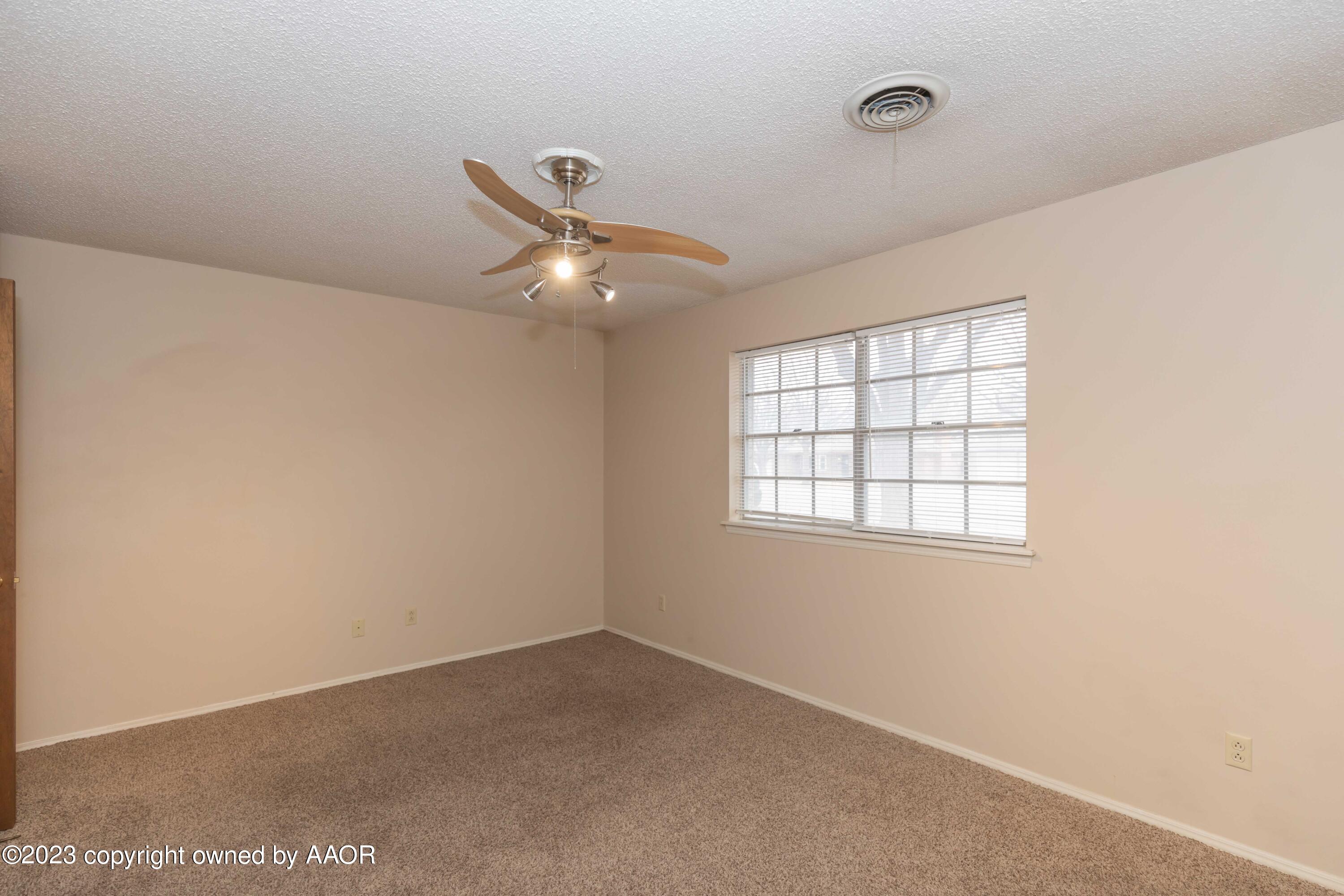 3410 Harmony Street Amarillo, TX 79109 - Photo 36 of 41 an empty room with a window
