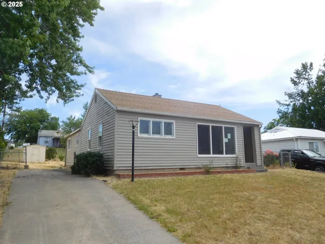 a house with trees in the background