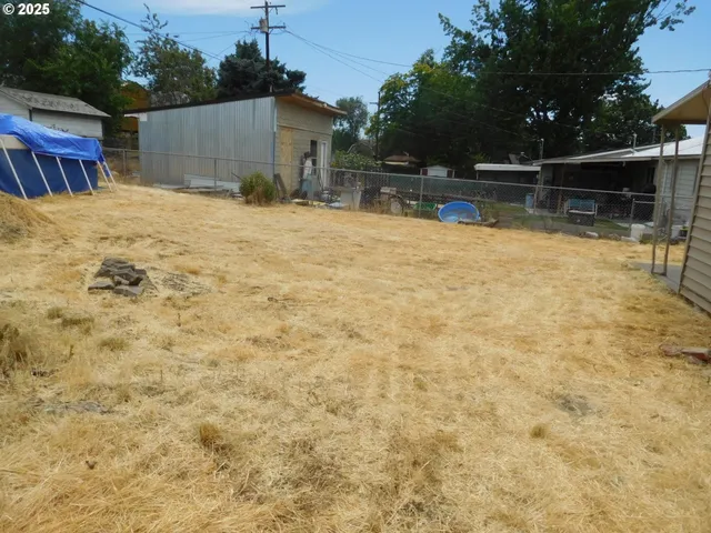 a view of house with yard