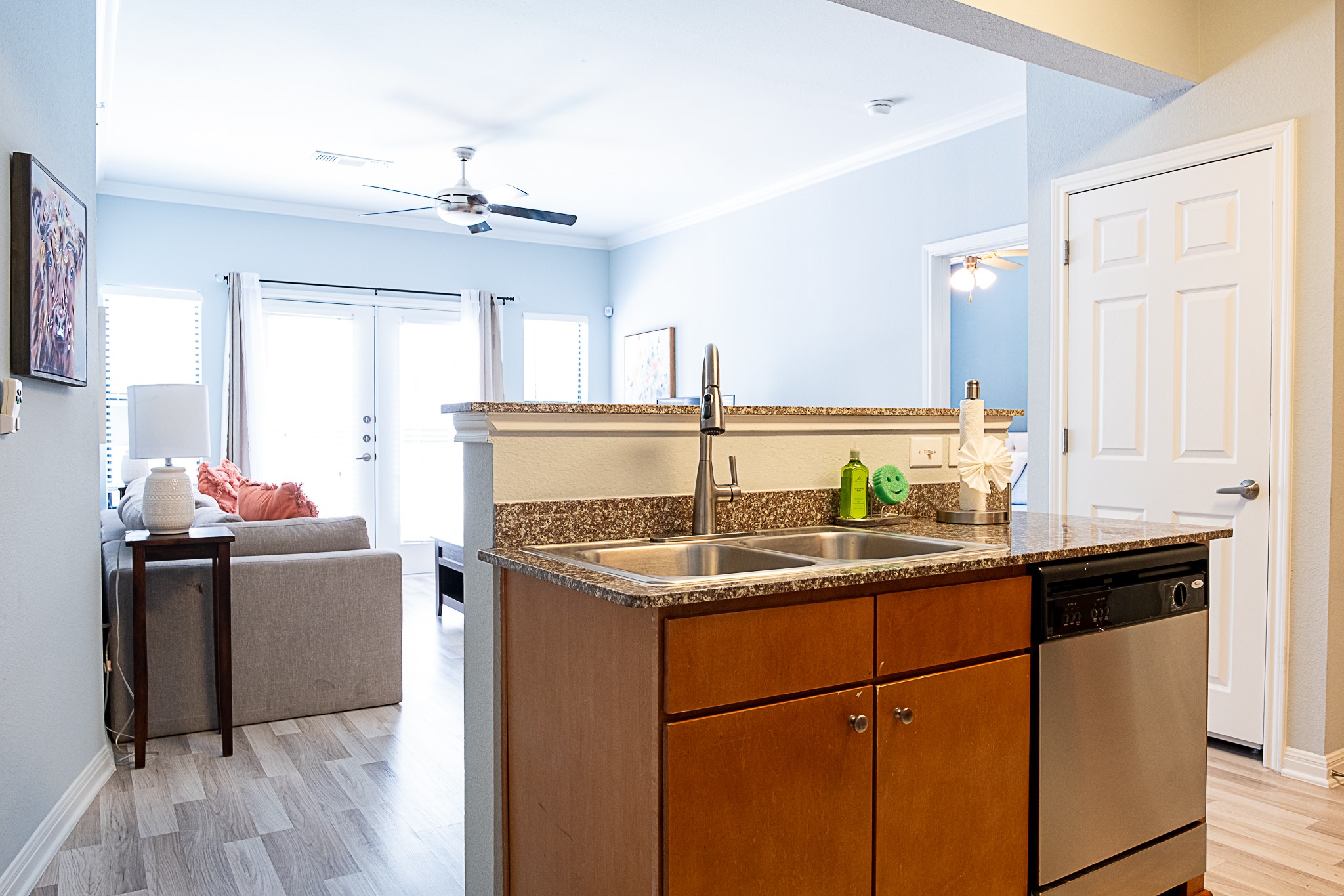 2502 Leon Street, Unit 309 Austin, TX 78705 - Photo 7 of 19 a kitchen with stainless steel appliances granite countertop a sink stove and refrigerator