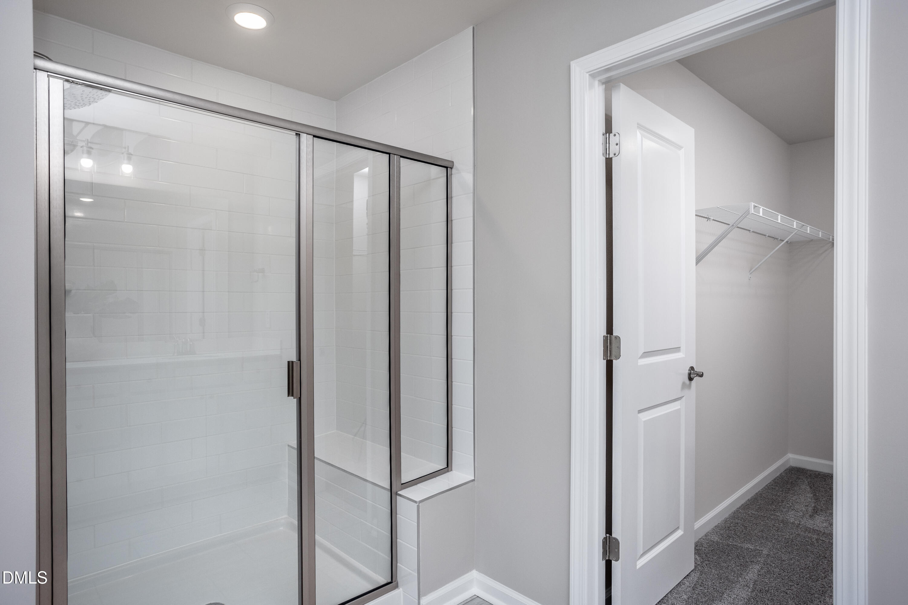 215 Broomside Avenue Raleigh, NC 27603 - Photo 13 of 25 a bathroom with a glass shower door
