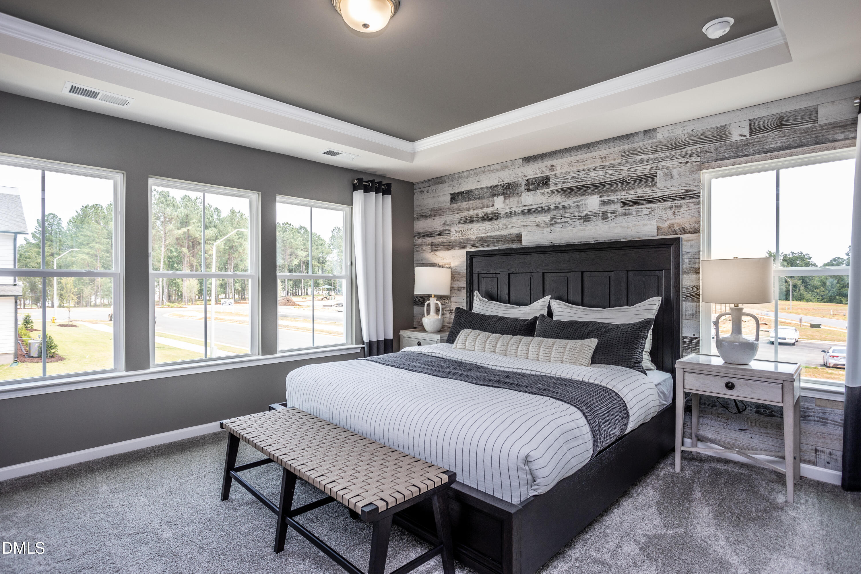 215 Broomside Avenue Raleigh, NC 27603 - Photo 10 of 25 a bed sitting in a bedroom next to a window