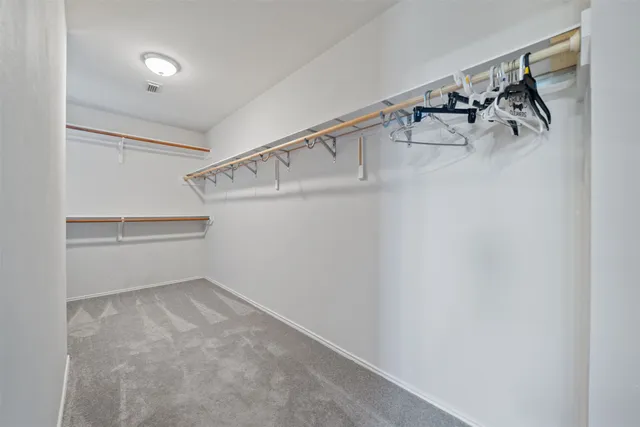 a view of walk in closet with window