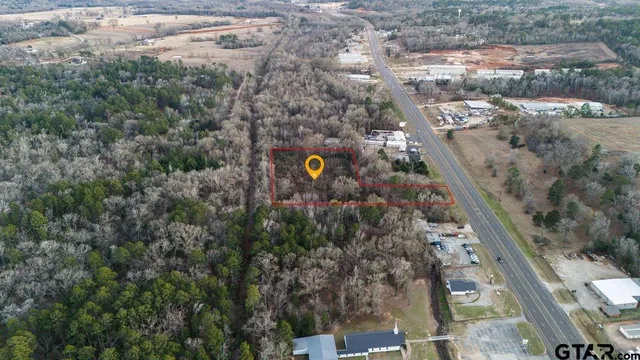 an aerial view of a house with a garden