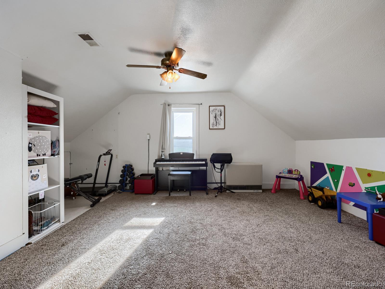 24379 Main Street Elbert, CO 80106 - Photo 17 of 29 a bedroom with furniture and a baby crib