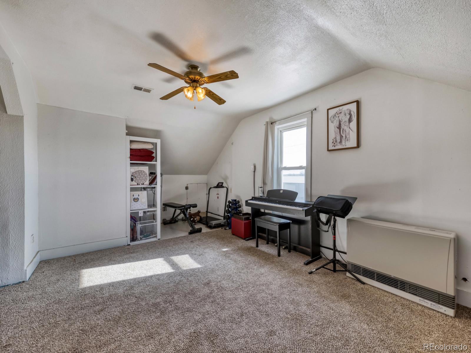 24379 Main Street Elbert, CO 80106 - Photo 19 of 29 a view of a workspace with furniture and a window