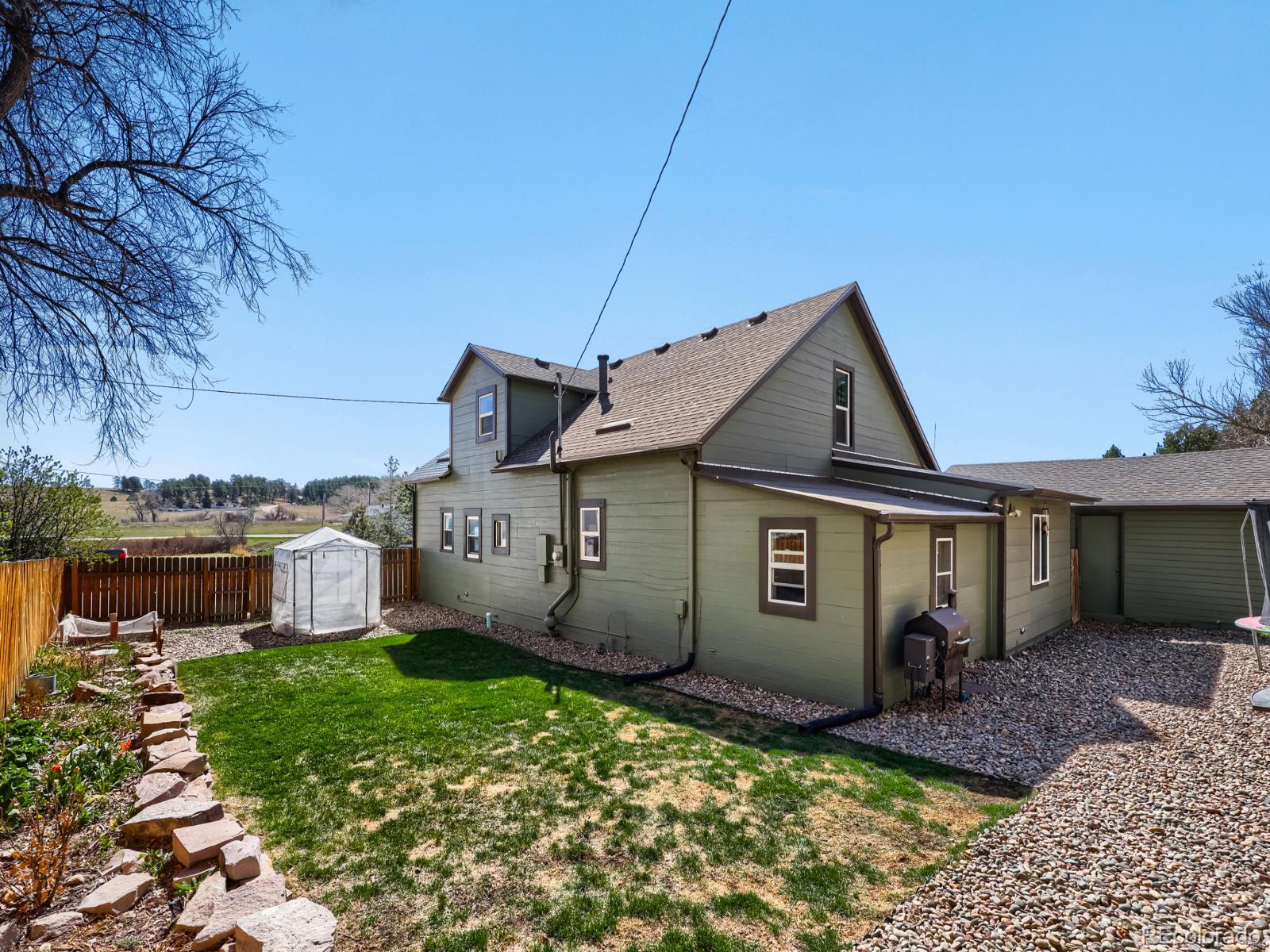 24379 Main Street Elbert, CO 80106 - Photo 24 of 29 a view of a house with a yard
