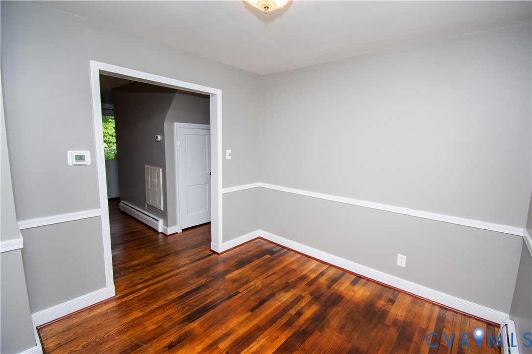 6800 Three Chopt Road Richmond, VA 23226 - Photo 9 of 26 Hardwood flooring, chair rail molding, ceiling-mou