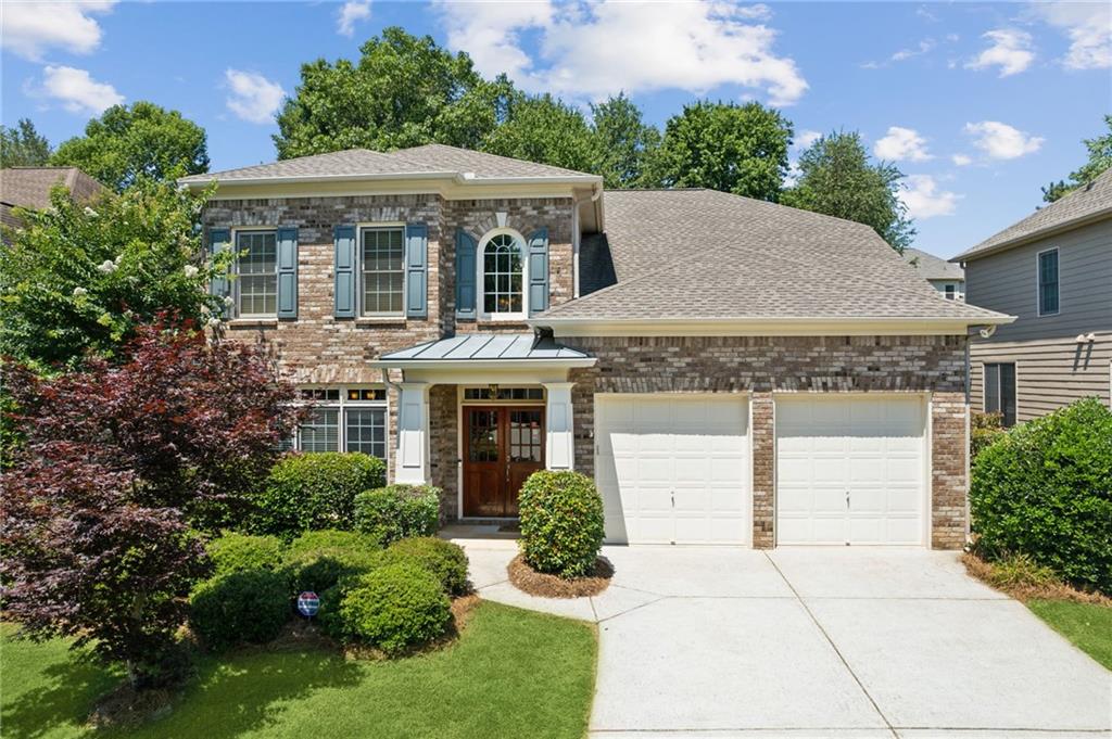 820 Freedom Way Cumming, GA 30040 - Photo 1 of 1 a aerial view of a house with yard and plants