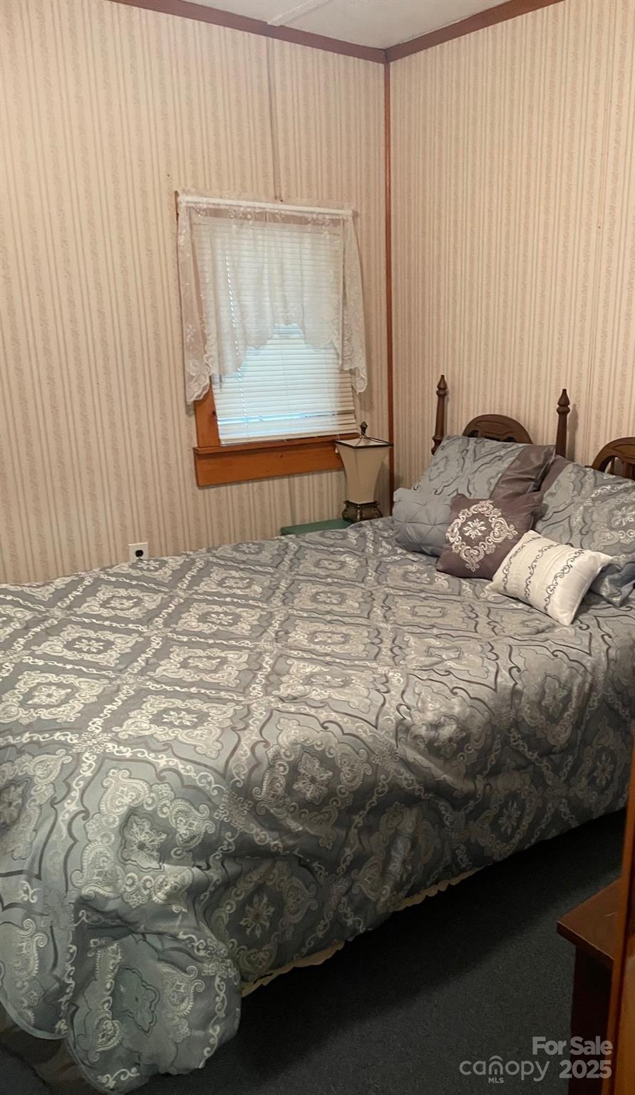 207 Rion Circle Winnsboro, SC 29180 - Photo 16 of 17 a bedroom with a bed and a window