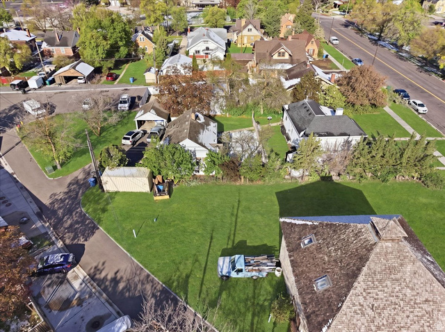 348 East 200 North Logan, UT 84321 - Photo 8 of 41 Expansive green lawn parcel featuring a mature tree line and street access