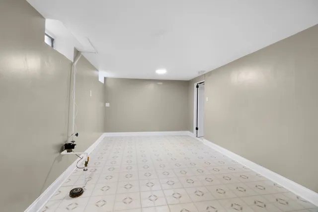 a bathroom with a tub shower and sink