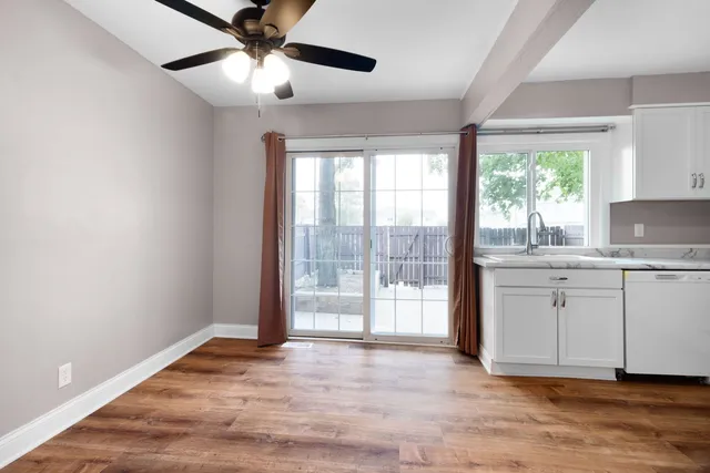 a view of a kitchen with a sink and a window
