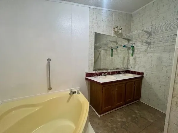 a bathroom with a sink and mirror