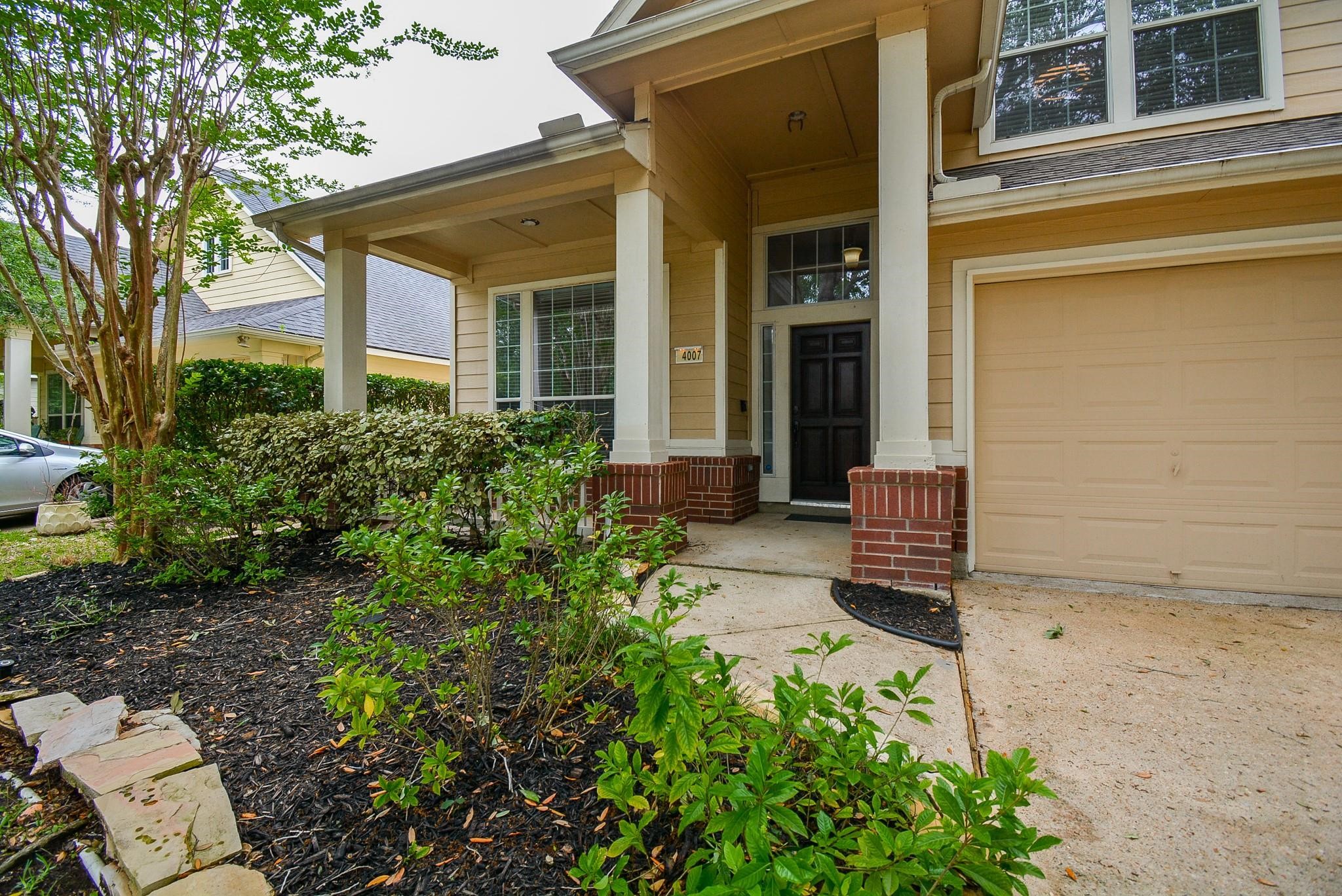 4007 Gazebo Lane Missouri City, TX 77459 - Photo 1 of 21 front view of a house with a garden