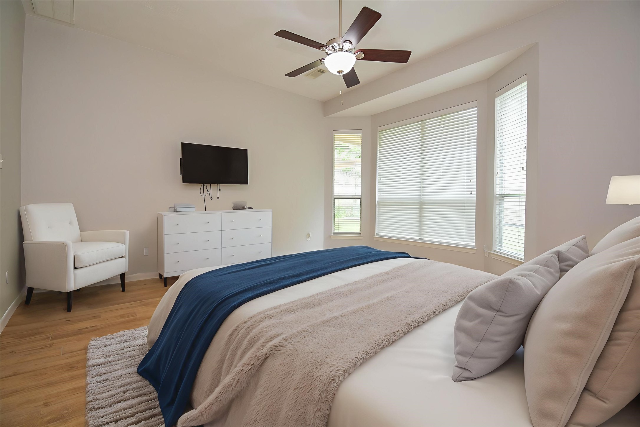 4007 Gazebo Lane Missouri City, TX 77459 - Photo 9 of 21 Primary Suite, discreetly located on the first floor, offers a private and tranquil oasis with large windows overlooking the back yard. (virtually staged)