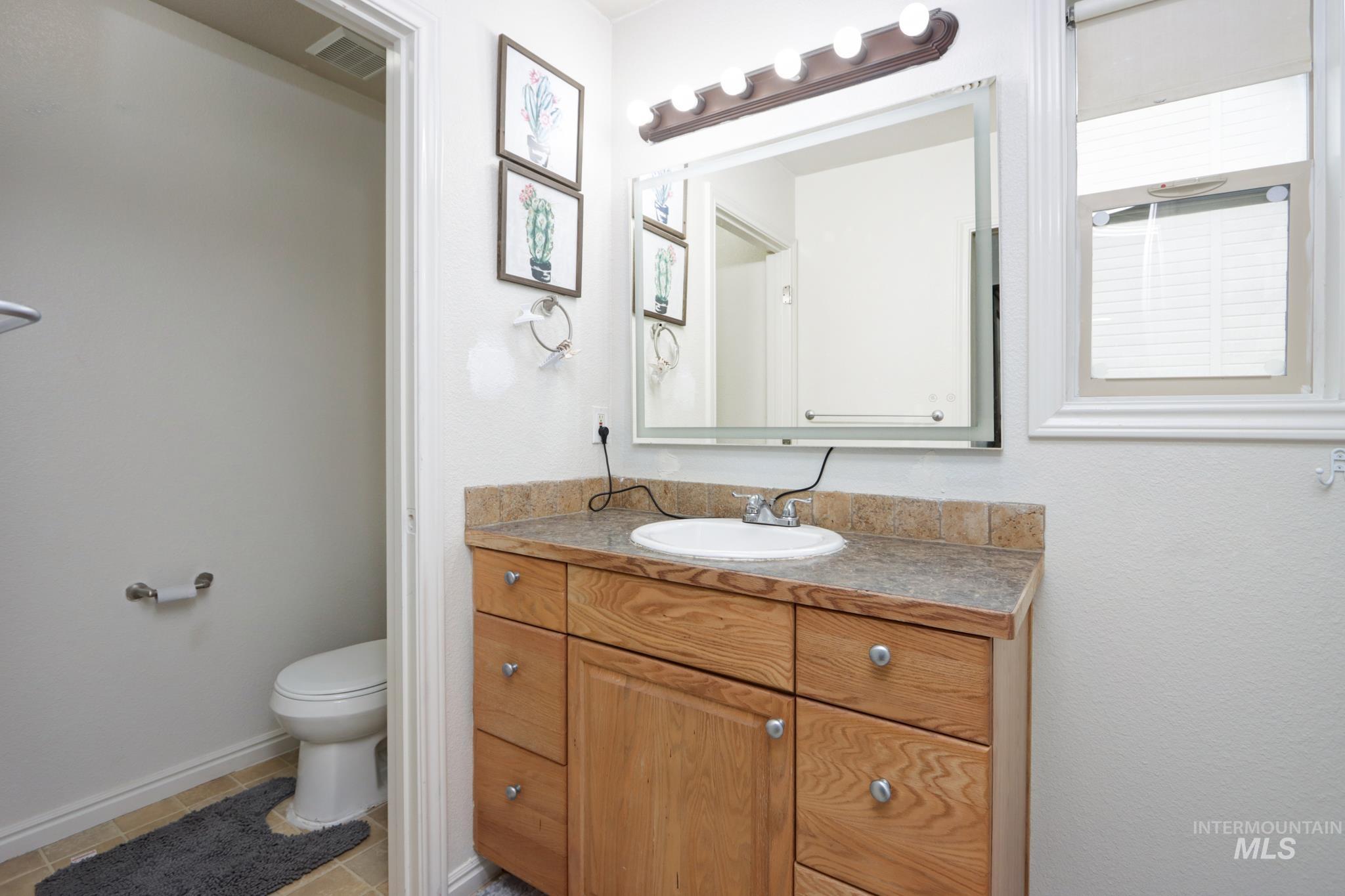 1010 North Rodeo Street Parma, ID 83660 - Photo 11 of 19 Bathroom with vanity and toilet