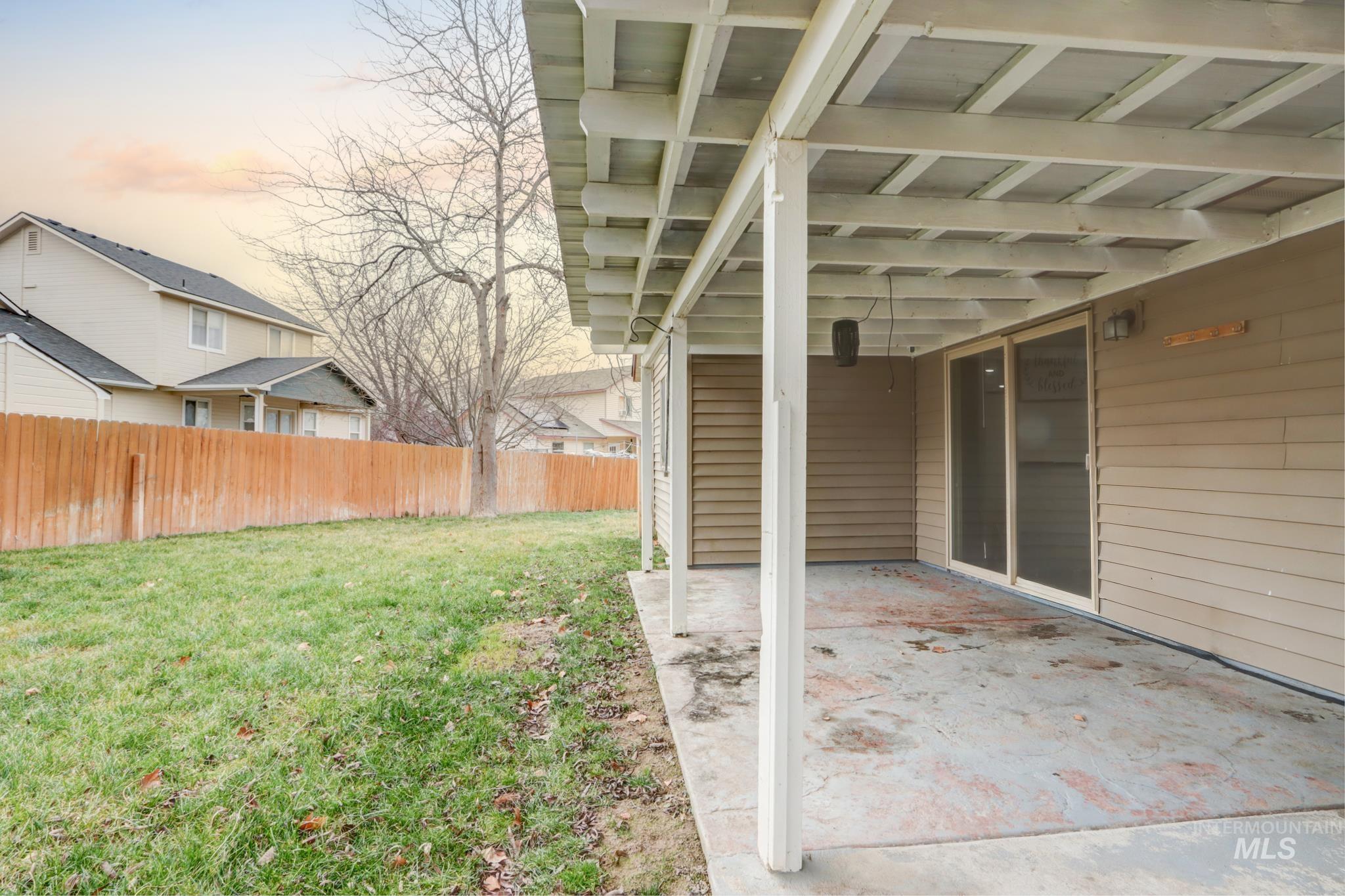 1010 North Rodeo Street Parma, ID 83660 - Photo 18 of 19 Fenced yard featuring a patio