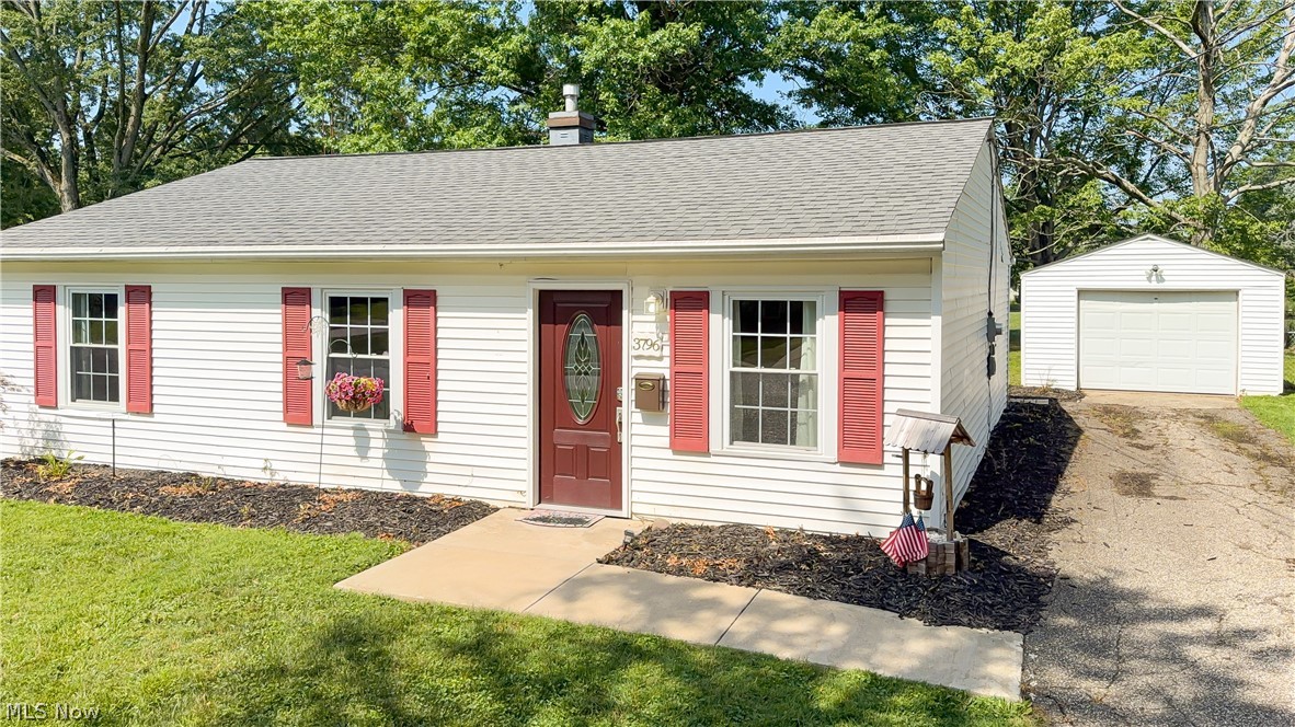 3796 North Santom Road Stow, OH 44224 - Photo 2 of 30 White siding exterior with red window shutters and a matching red front door with an oval glass insert